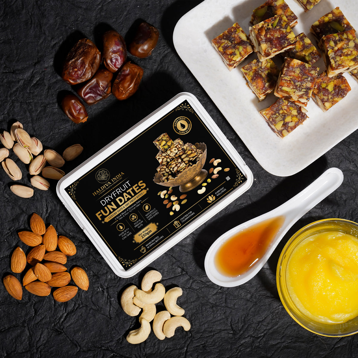 Rakhi Gift Hamper featuring Dry Fruit Fun Dates, almonds, cashews, and sesame sweets in an elegant presentation.